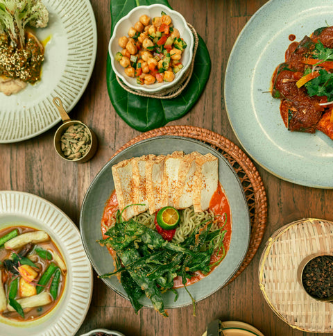 A classic street dish, Chilled Mee Rebus, made with daily handmade scallion noodles and served with chilled sweet potato, tomato infused broth